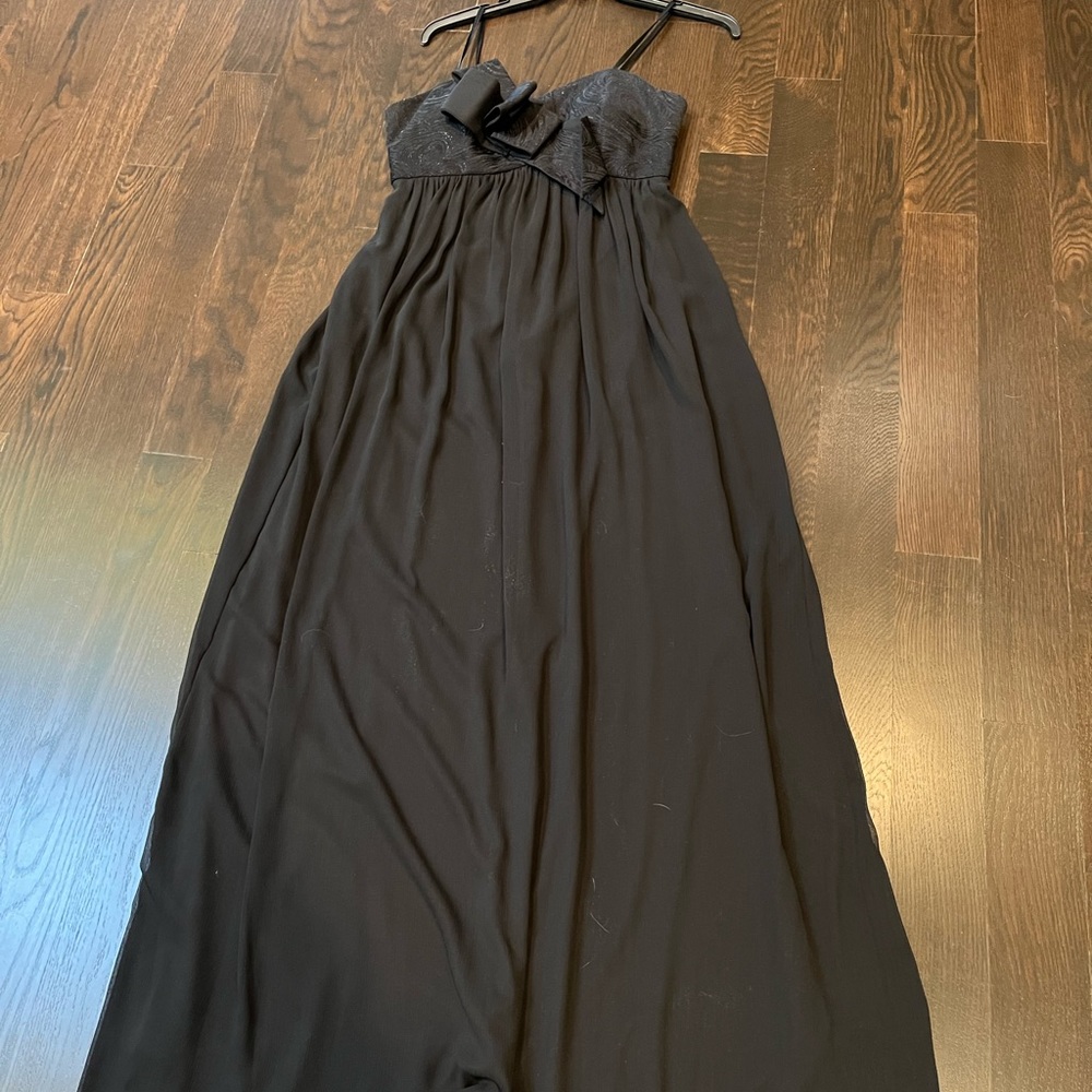 Brand new black flowy gown .